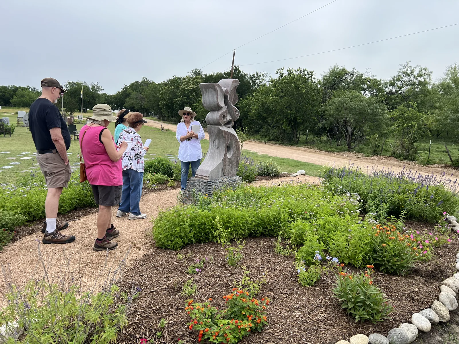 Families gathering in the gardens for a community event